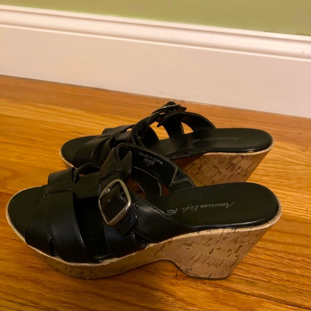 Black wedge sandals with silver buckle